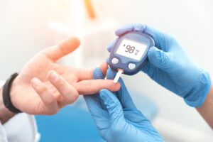 a person using a device to check the blood sugar level